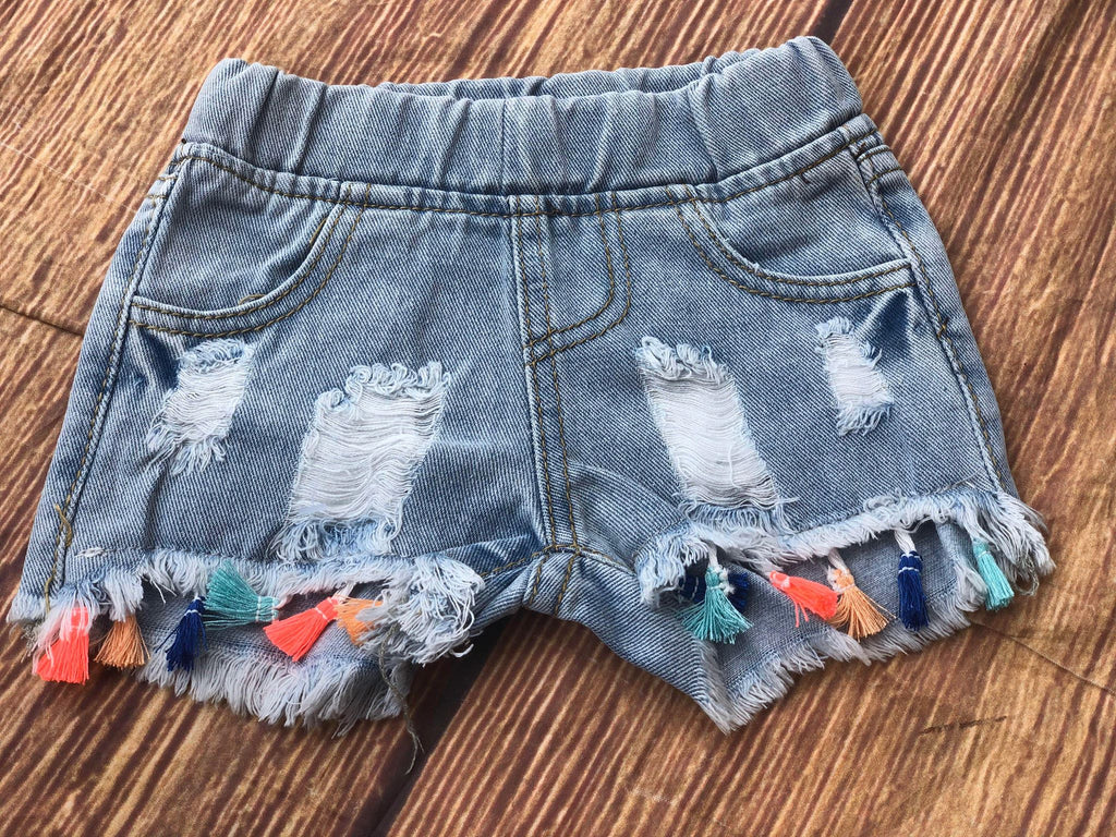 DISTRESSED TASSEL DENIM SHORTS